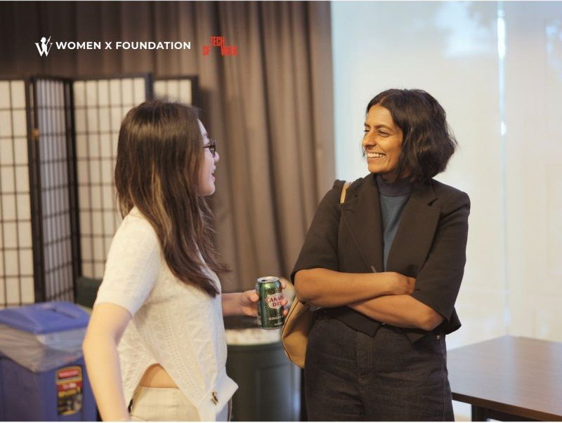 Two guests in conversation at Women X San Francisco